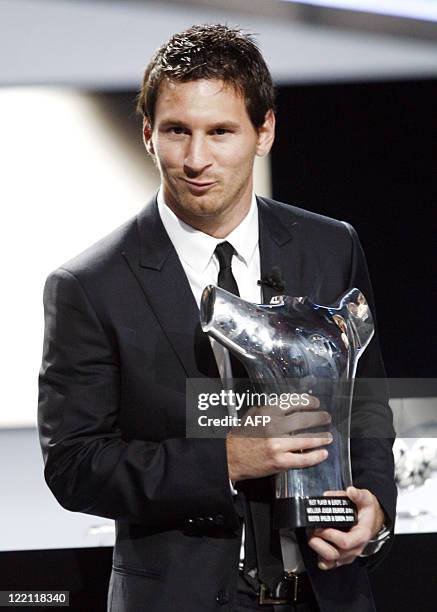 Barcelona's Argentinian forward Lionel Messi poses with his trophy for the Best Player in Europe 2010/2011, on August 25 after the draw for the UEFA...