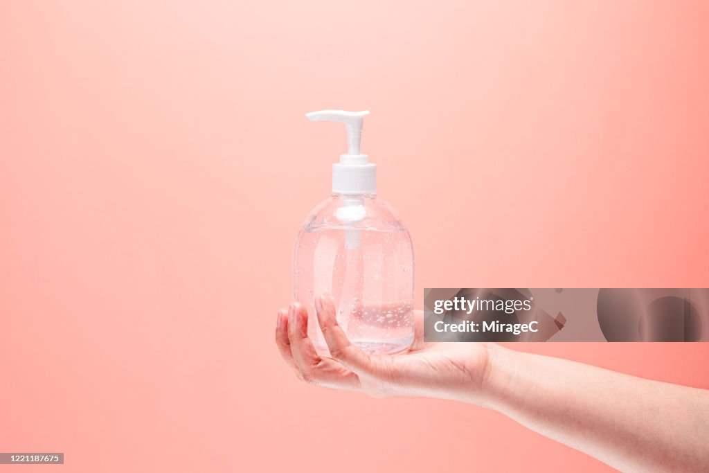 Hand Holding Ethanol Alcohol Gel Hand Sanitizer