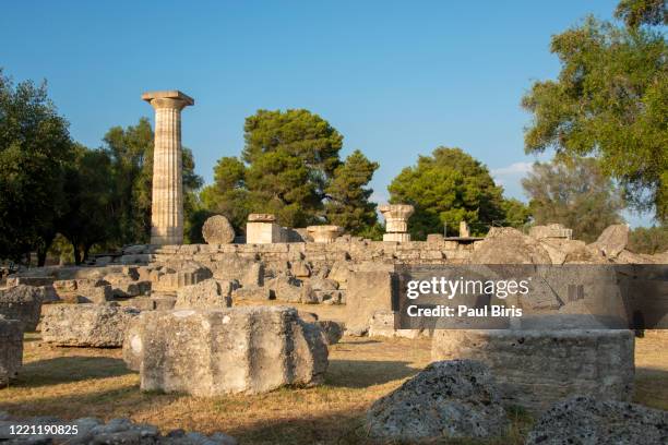 a row of ruined columns remain at the temple of hera at olympia, greece. - olympia stock pictures, royalty-free photos & images