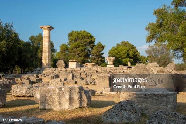 a row of ruined columns remain at the temple of hera at olympia, greece. - paul of greece - fotografias e filmes do acervo