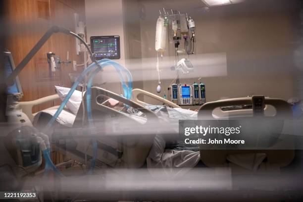 Breathing tubes hang next to a man with COVID-19 on a ventilator at a Stamford Hospital Intensive Care Unit on April 24, 2020 in Stamford,...