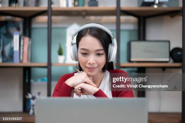 close-up shot of an attractive young businesswoman working with video conference at home - girls learning online imagens e fotografias de stock