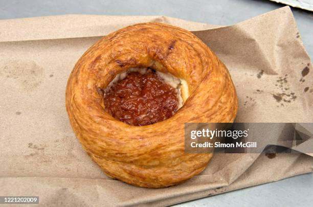 guava danish pastry on a takeaway paper bag - guava jam stock pictures, royalty-free photos & images