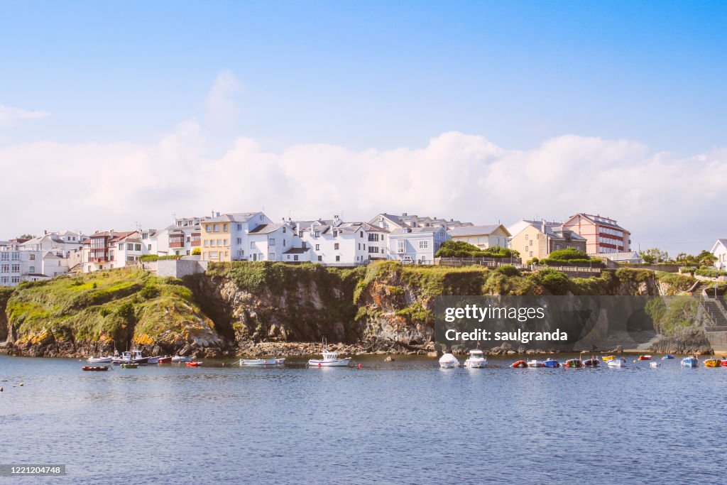 Fishing village on a cliff seen from the sea