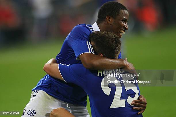 Klaas-Jan Huntelaar celebrates the fifth goal with Jefferson Farfan during the UEFA Europa League play-off second leg match between FC Schalke and...