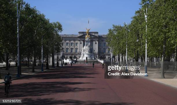 Members of the public go down The Mall , where the finish of the London Marathon was due to take place, on April 26, 2020 in London, England. The...