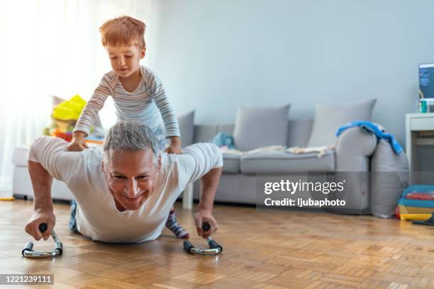 happy boys - dad press ups kids stock pictures, royalty-free photos & images