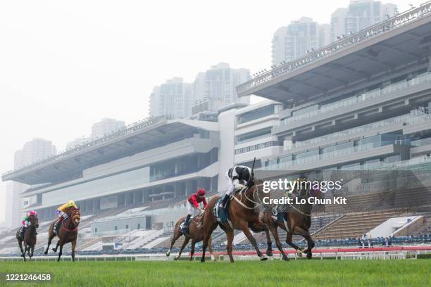 April 26 : Jockey Zac Purton riding Exultant wins the Race 8 FWD Queen Elizabeth II Cup at Sha Tin Racecourse on April 26, 2020 in Hong Kong. Jockey...