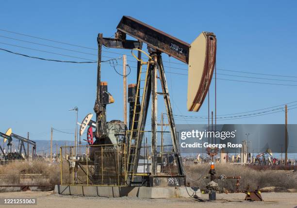 Oil pipelines, pumping rigs, and electrical transmission lines dot the landscape along California's "Petroleum Highway" running along the...