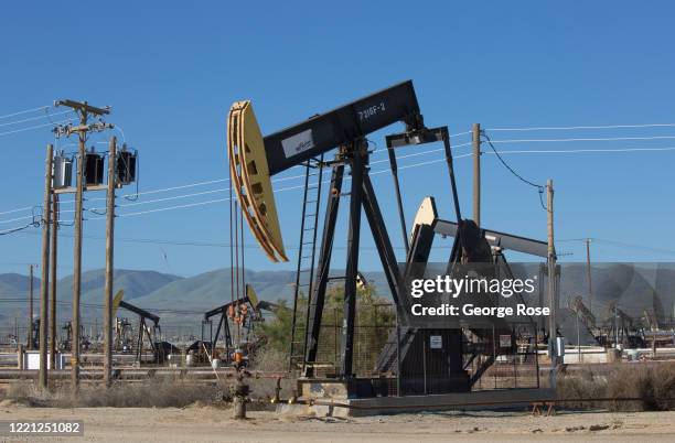 Oil pipelines, pumping rigs, and electrical transmission lines dot the landscape along California's "Petroleum Highway" running along the...