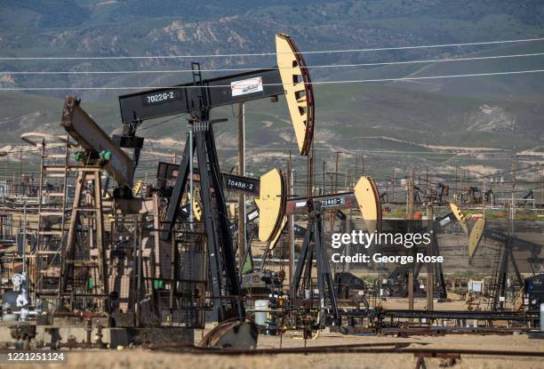 Oil pipelines, pumping rigs, and electrical transmission lines dot the landscape along California's "Petroleum Highway" running along the...