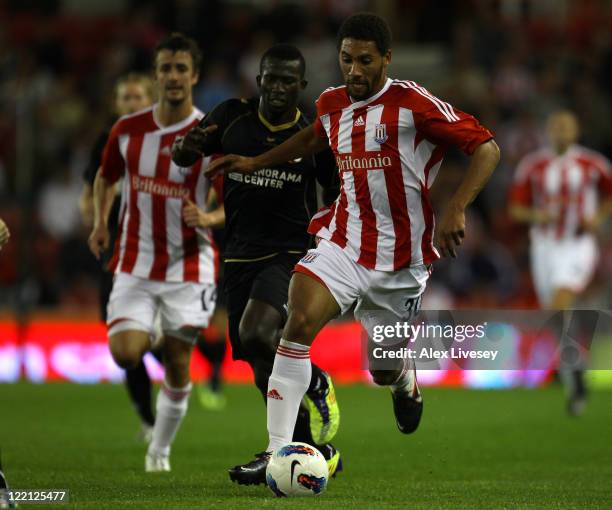 Ryan Shotton of Stoke City beats Sekou Sanogo Junior of FC Thun during the UEFA Europa League play-off second leg match between Stoke City and FC...