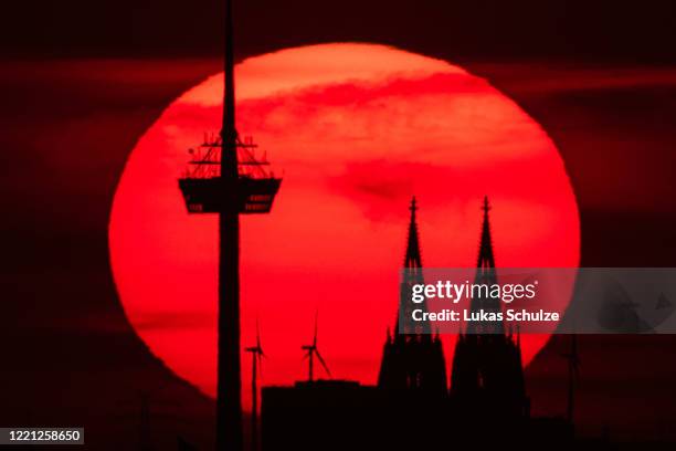 The Koelner Dom cathedral stands at sunset during the coronavirus crisis on April 26, 2020 in Cologne, Germany. Germany is taking its first steps to...