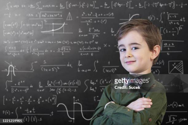 little boy mathematics formula an der tafel - boy in hard hat stock-fotos und bilder