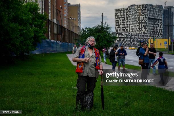 Moscow fan smokes a cigarette before entering in the VEB Arena stadium prior the Russian Premier League football match between CSKA Moscow and Zenit...