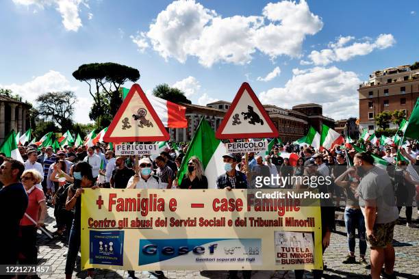 Group of protester carry a manifest againt the abuse of the social service at the far-right protest at ''Bocca Della Verita'' in Roma call from...