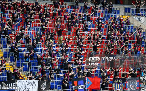 Moscow fans cheer for their team during the Russian Premier League football match between CSKA Moscow and Zenit St. Petersburg at the VEB Arena...