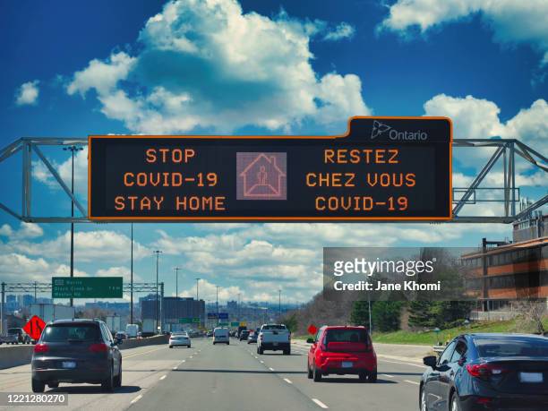 road sign stop spread covid-19, stay home - stay home stock pictures, royalty-free photos & images