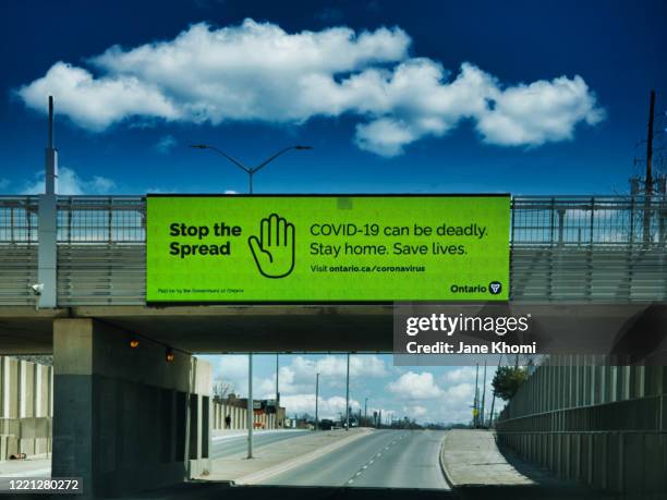 road sign stop spread covid-19, stay home - jane boone stock-fotos und bilder