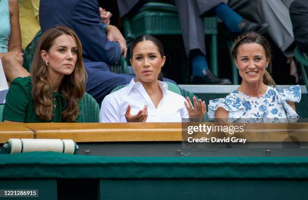 Catherine, Duchess of Cambridge sits with Meghan, Duchess of Sussex, and Pippa Middleton in the Royal Box on Centre Court ahead of the Ladies Singles...