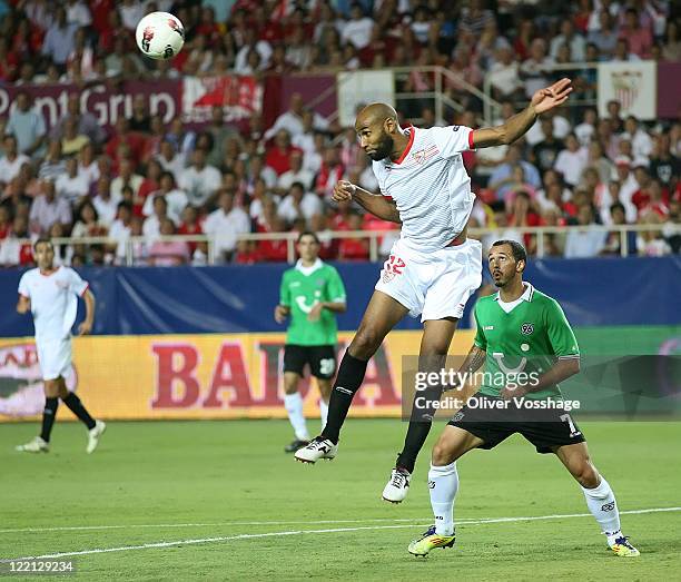 Sevilla player Frederic Kanoute saves the Ball with his head while Sergio Pintohas of Hannover has no chance to reach the ball during the UEFA Europa...