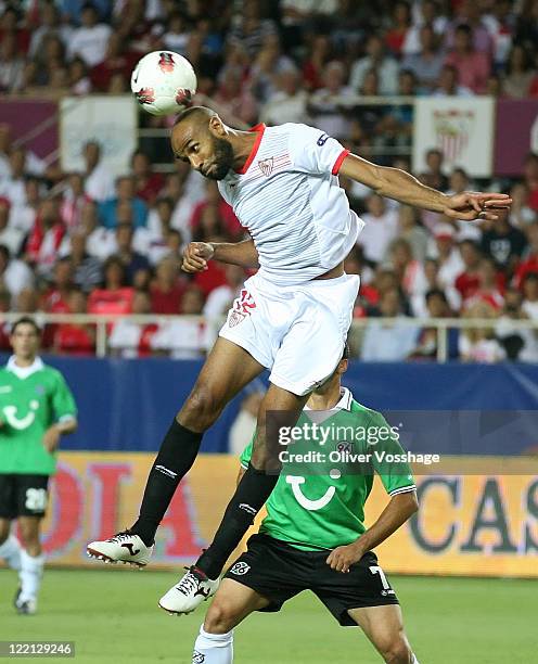 Sevilla player Frederic Kanoute saves the Ball with his head while Sergio Pintohas of Hannover has no chance to reach the ball during the UEFA Europa...