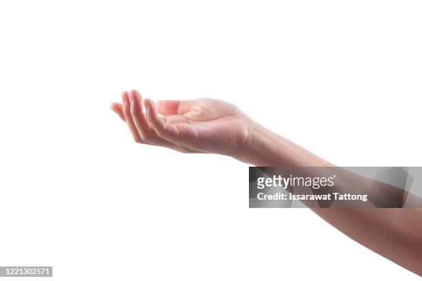 side view of human hand in reach out one's hand gesture isolate on white background , low contrast for retouch or graphic design - mano abierta fotografías e imágenes de stock