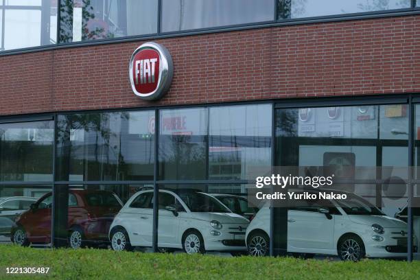 The Fiat logo is seen outside a dealer in Noordwijk, Netherlands.