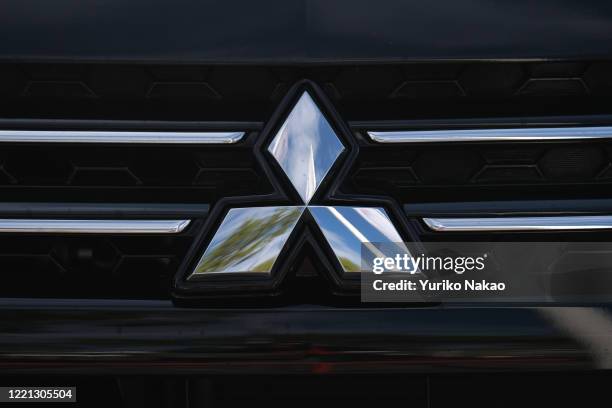 The Mitsubishi Motors logo is seen on an vehicle displayed outside a dealer in Noordwijk, Netherlands.