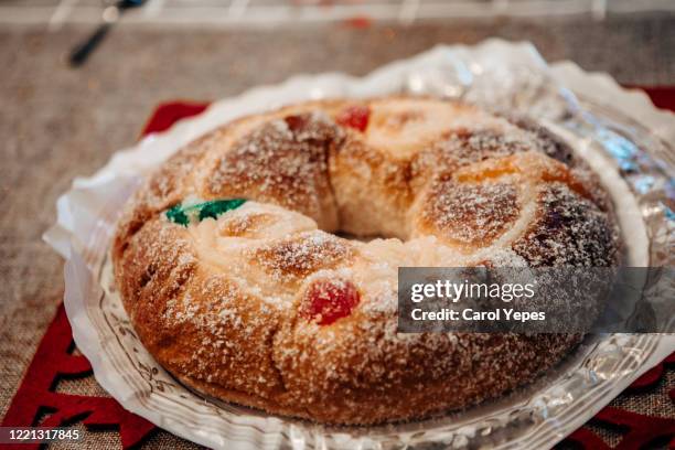 roscon de reyes, kings' ring typical dessert eaten in spain to celebrate epiphany or dia de reyes magos - roscon de reyes stock pictures, royalty-free photos & images