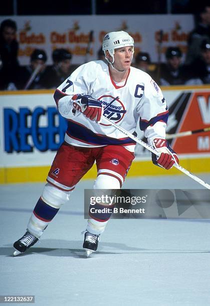 Keith Tkachuk of the Winnipeg Jets skates on the ice during an NHL game against the Los Angeles Kings circa 1992 at the Winnipeg Arena in Winnipeg,...