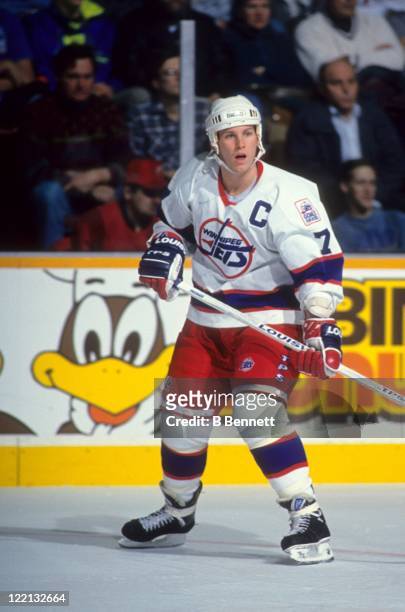 Keith Tkachuk of the Winnipeg Jets skates on the ice during an NHL game in December, 1993 at the Winnipeg Arena in Winnipeg, Manitoba, Canada.