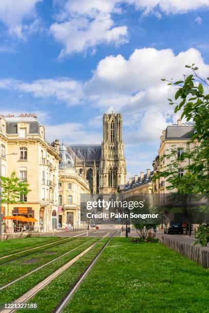 city street amidst old buildings at reims city - reims stock-fotos und bilder