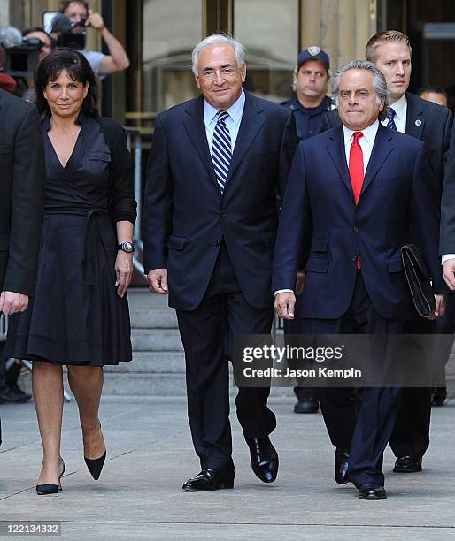 Anne Sinclair, Dominique Strauss-Kahn and lawyer Benjamin Brafman leave Manhattan Criminal Court after attending a status hearing on the sexual...