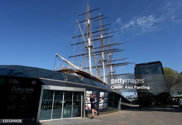 General view as a jogger runs around the Cutty Sark on April 26, 2020 in London, England. The 40th London Marathon was due to take place today, with...