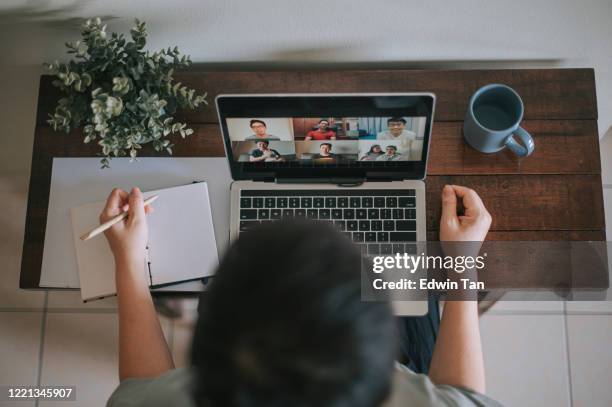 an asian chhinese mid adult woman at her home office video conference with casual clothing using laptop - corporate virtual event stock pictures, royalty-free photos & images