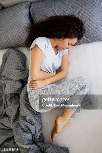 282 Woman Curled Up In Bed Stock Photos, High-Res Pictures, and Images ...