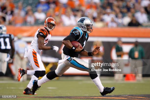 Cam Newton of the Carolina Panthers breaks free for a 26-yard run in the first half of an NFL preseason game against the Cincinnati Bengals at Paul...