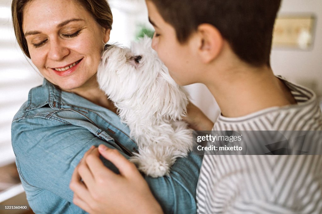 Mother and son with pet dog