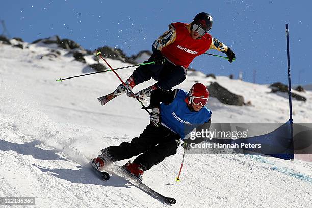 Nick Pascoe of New Zealand leads Scott Kneller of Australia in the Mens Ski Cross Heat 1 during day 14 of the Winter Games NZ at Cardrona Alpine...