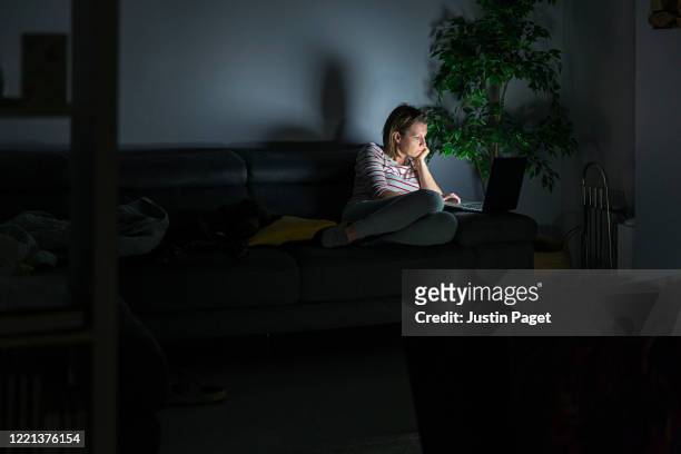 woman working from home late at night - quarantine stock pictures, royalty-free photos & images