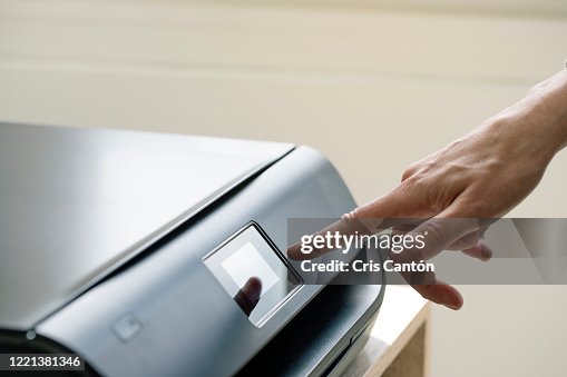 Hand using computer printer Hand using computer printer