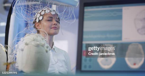brainwave scanning headset test in laboratory - brain wave mri stock pictures, royalty-free photos & images