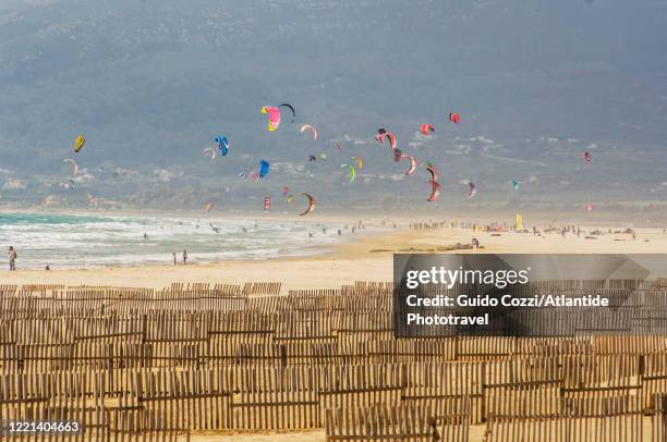 kite surf along the the big beach east of the town - tariffa stock pictures, royalty-free photos & images