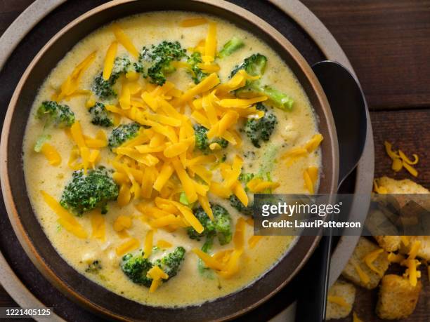 creamy broccoli and cheddar soup with crusty bread - soup stock pictures, royalty-free photos & images