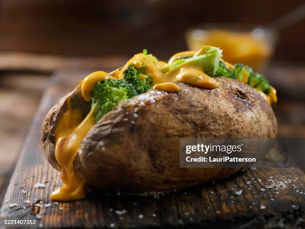 cheese and broccoli stuffed potatoes - jacket potato stock pictures, royalty-free photos & images