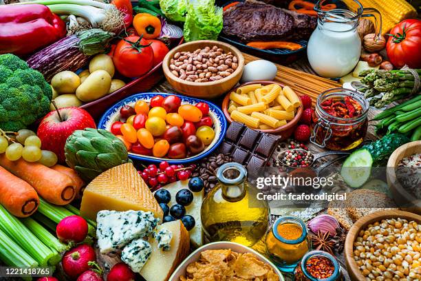 food backgrounds: table filled with large variety of food - food pyramid stock pictures, royalty-free photos & images