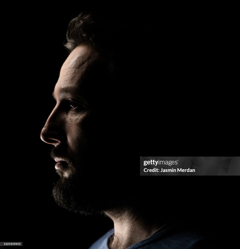Portrait of a man in dark background