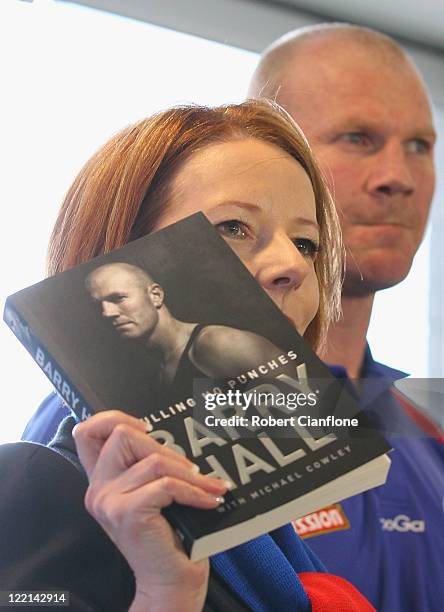 Prime Minister Julia Gillard talks at the official launch of Hall's new book 'Pulling No Punches' at Whitten Oval on August 26, 2011 in Melbourne,...