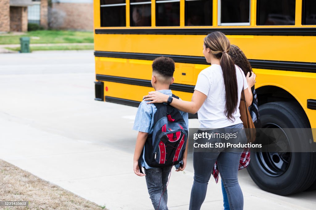 Mom walks her children after they get of bus